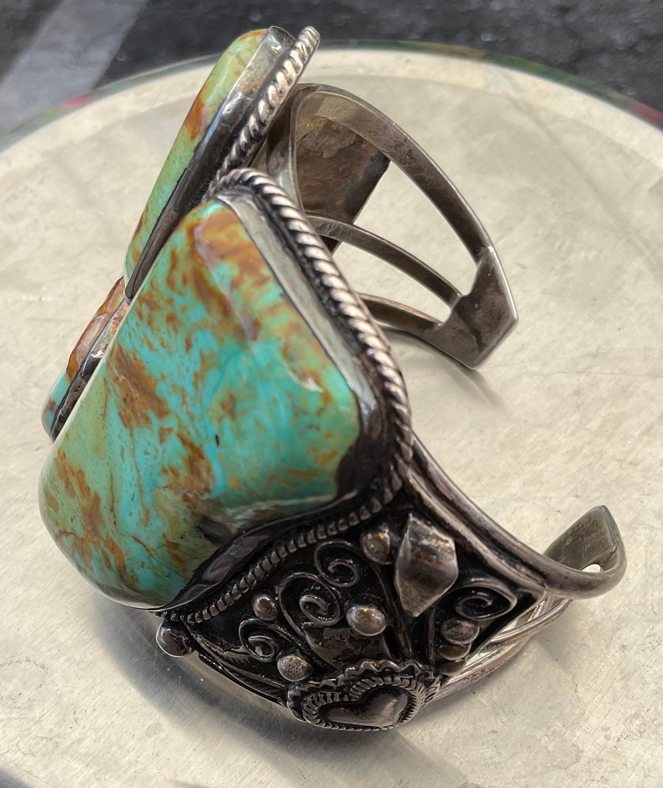 William Singer is one of my top three favored designers of Native American jewelry. He favors large stones, as I do, and creates pieces to cherish for a lifetime. This item is shown first on a woman's wrist and then on a man's. Please ensure your