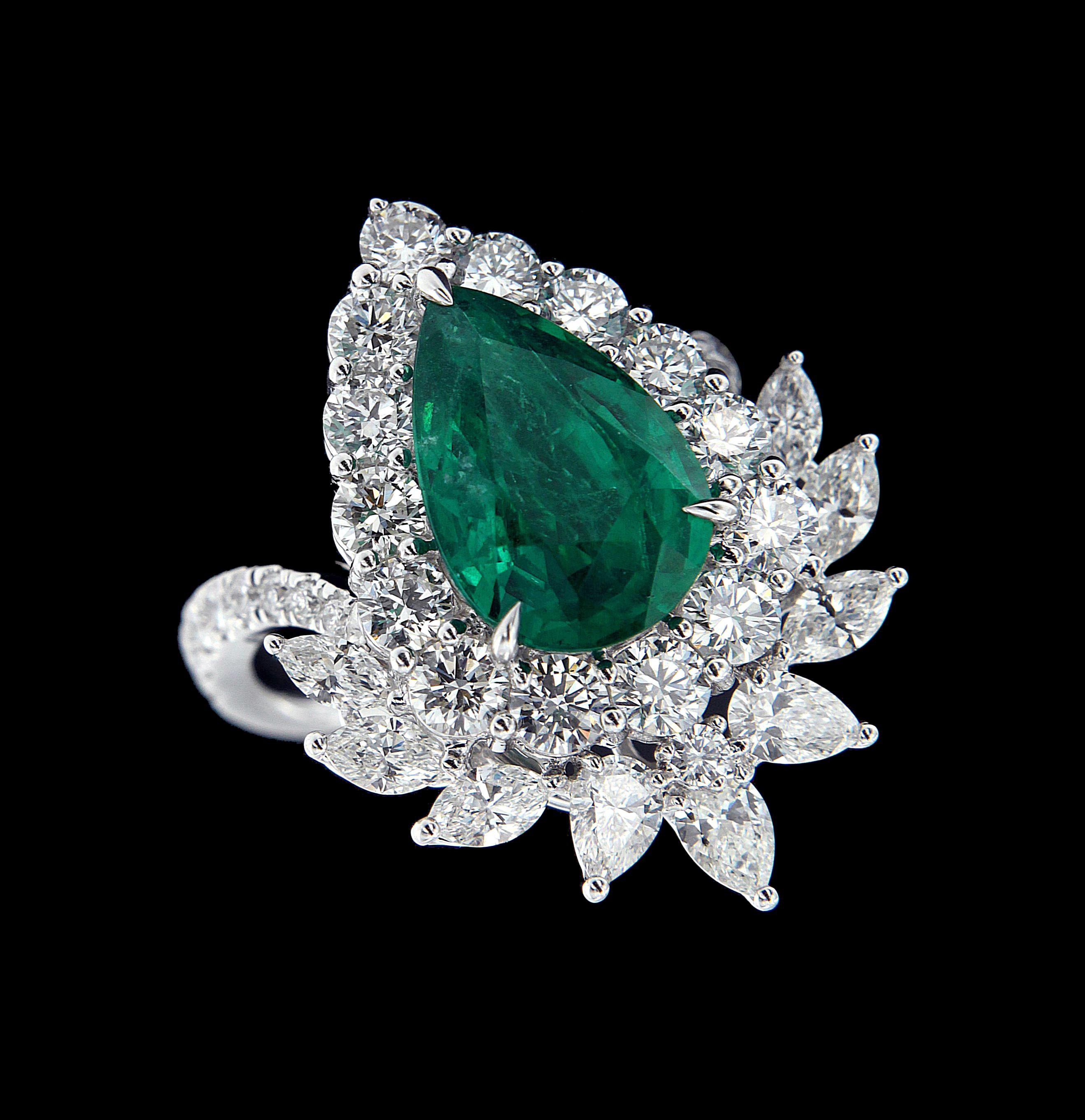 Pear Cut Subtle 18 Karat White Gold, Diamond and Emerald Ring For Sale