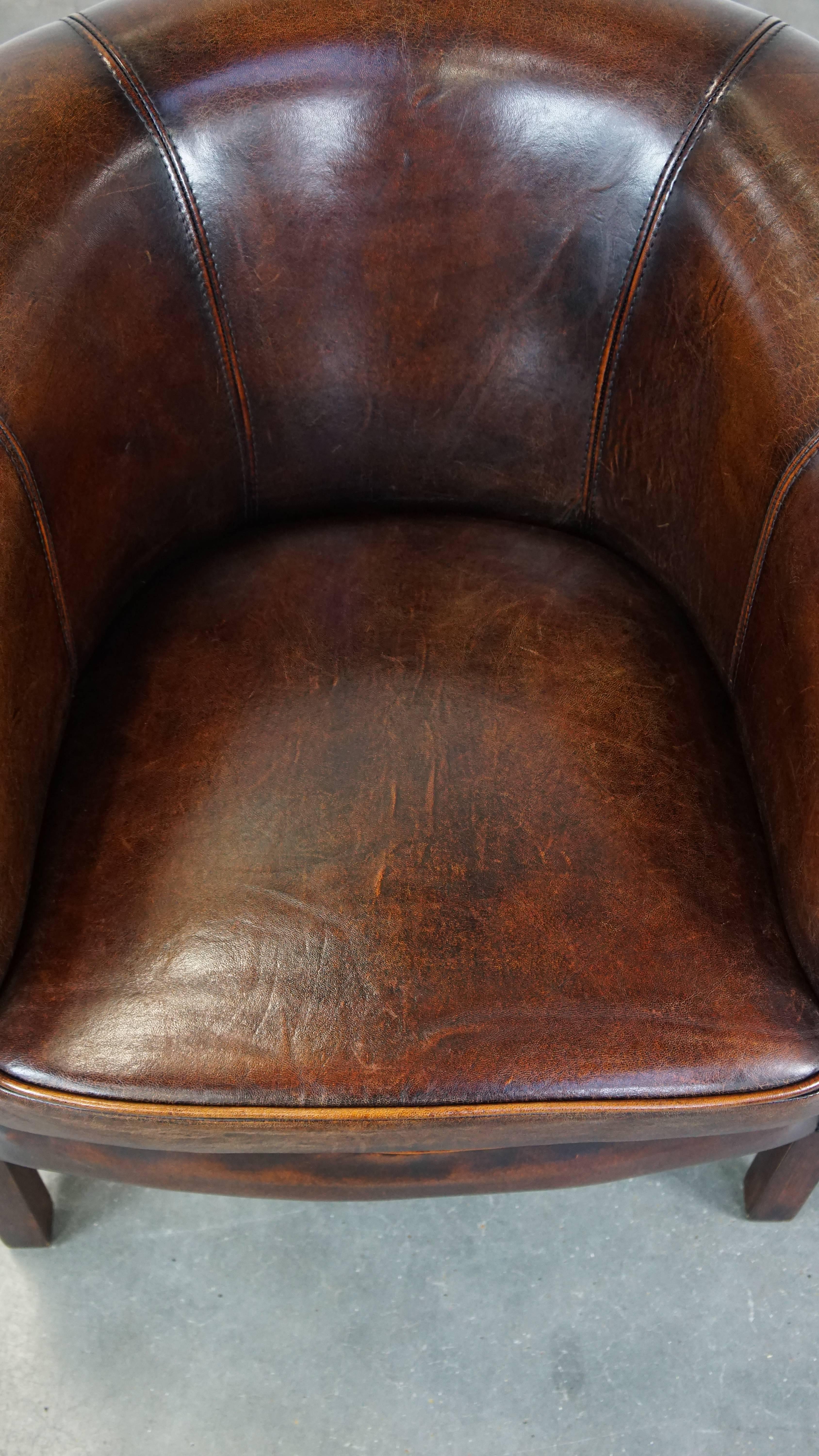 Sheepskin Subtle and well-maintained sheepskin leather club armchair in English style For Sale