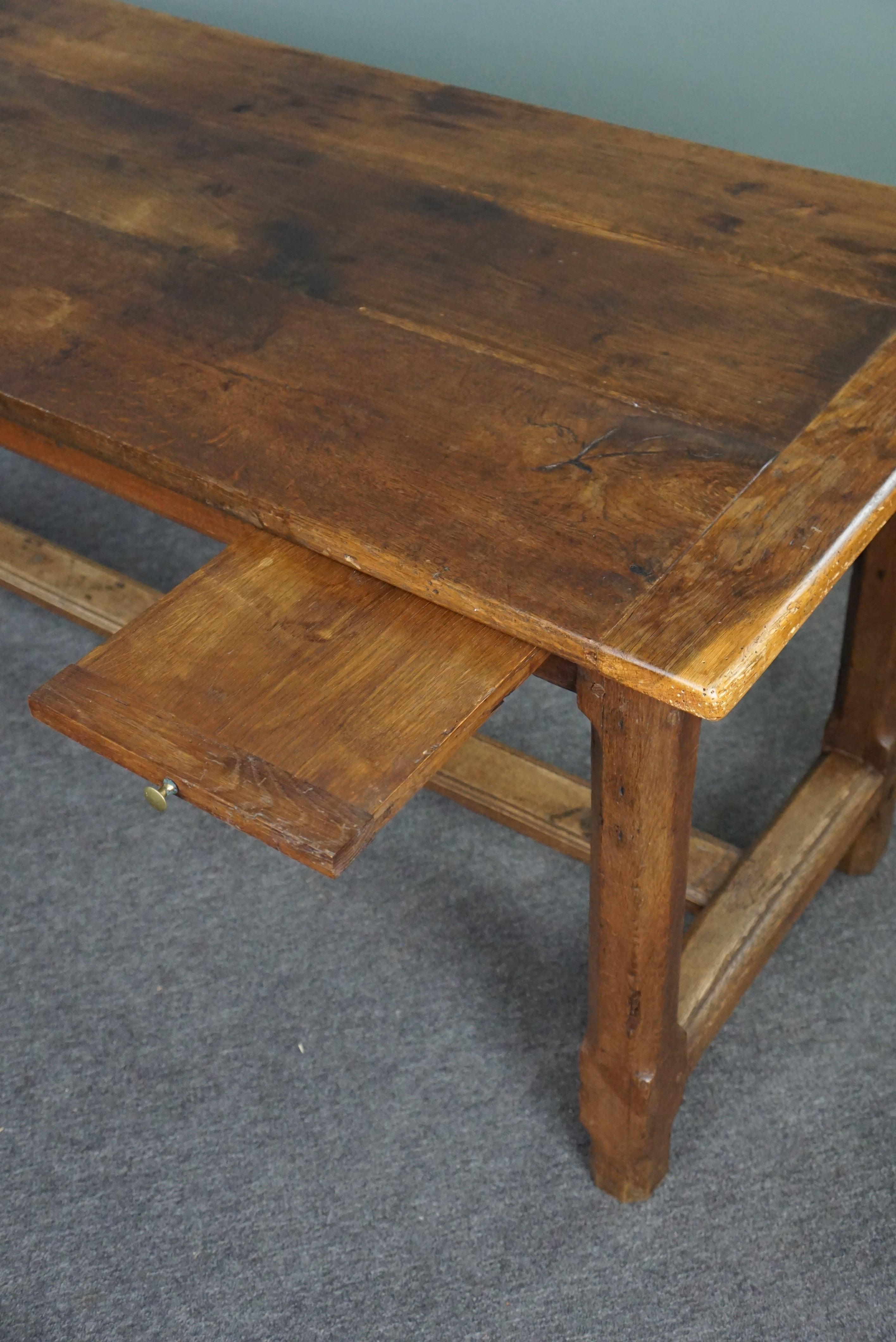 Subtle antique French oak dining table with breadboard and drawer For Sale 3