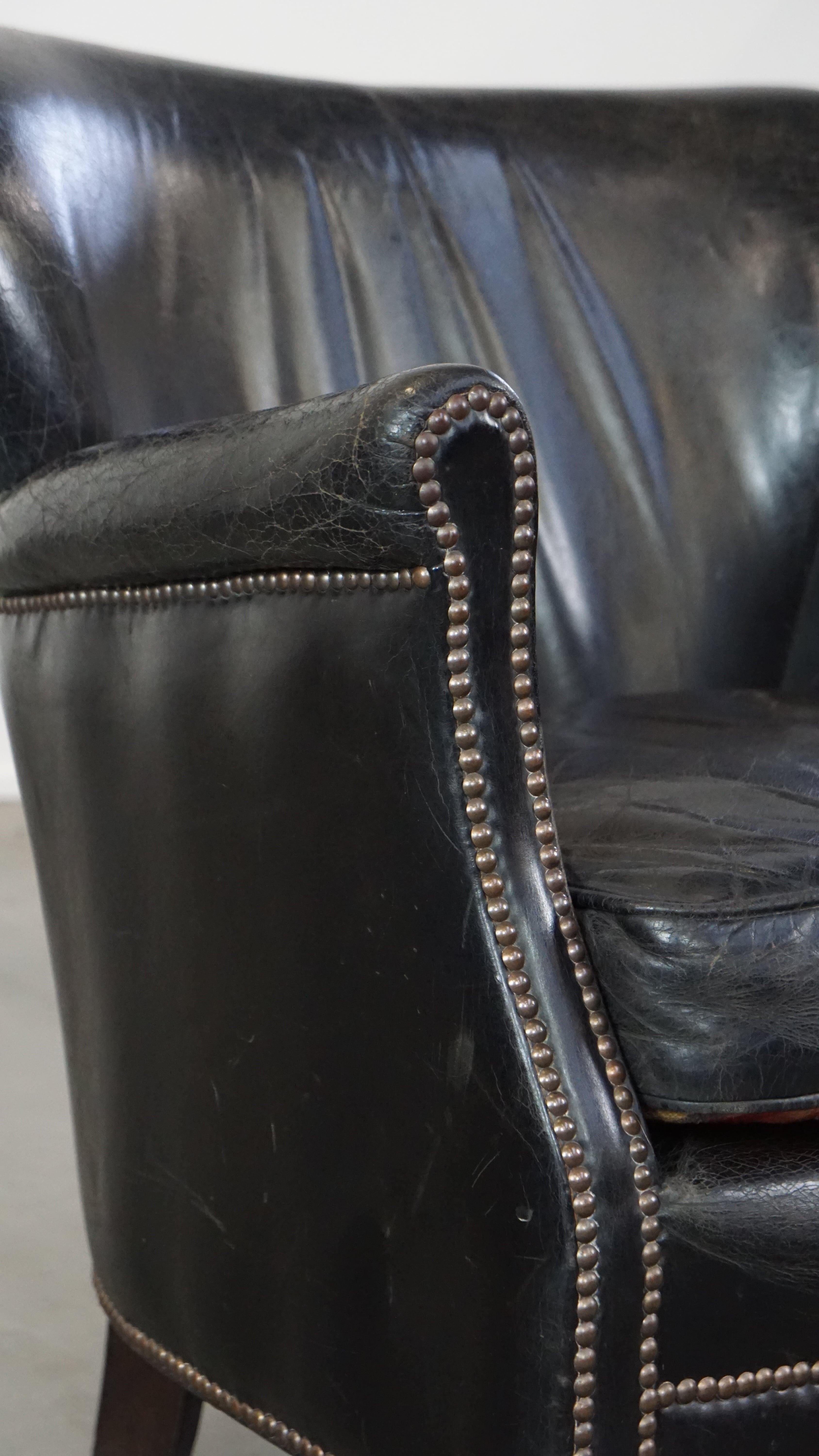 Subtle black cow leather armchair with reversible Kelim seat cushion For Sale 5