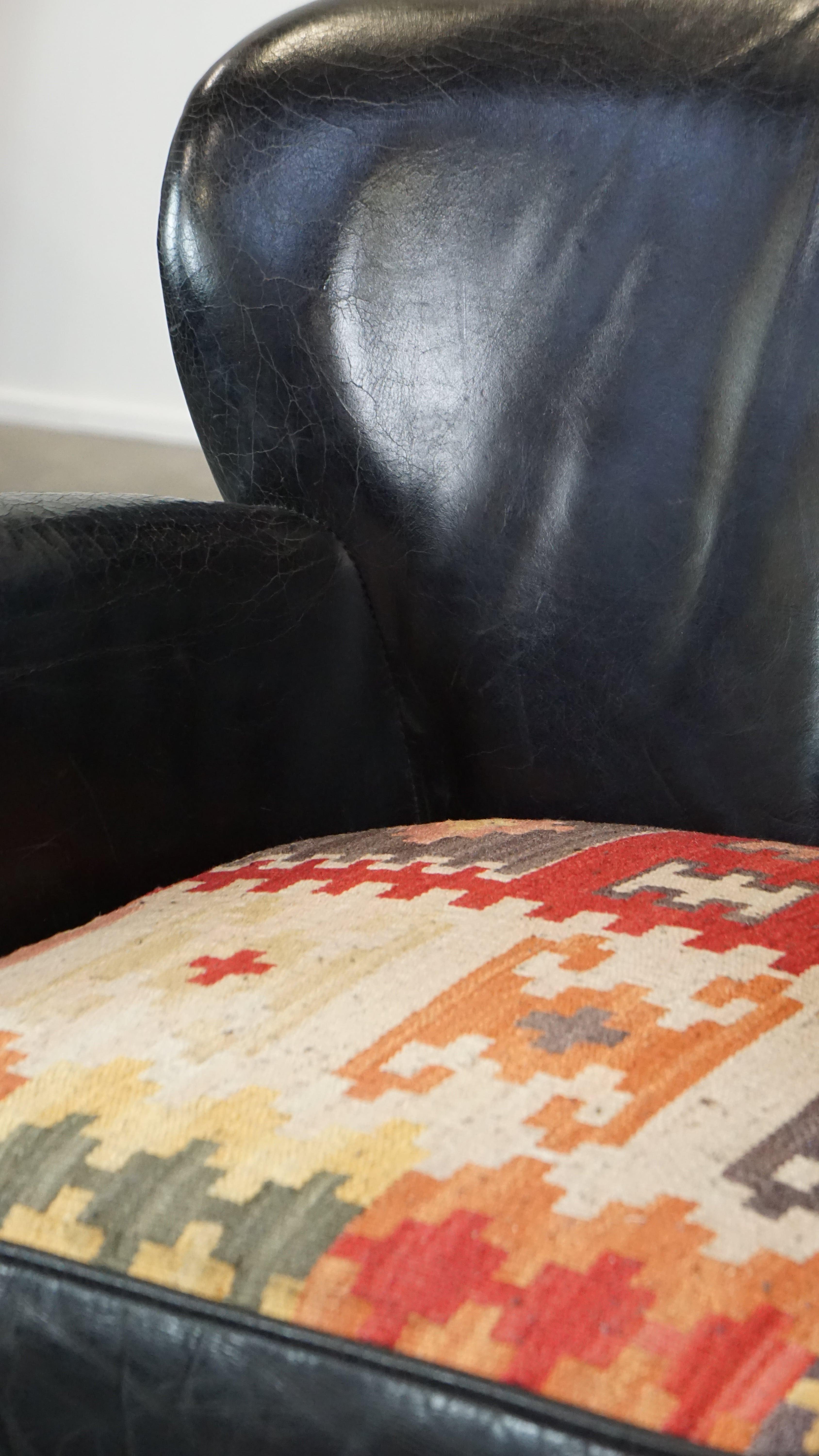 Subtle black cow leather armchair with reversible Kelim seat cushion For Sale 6