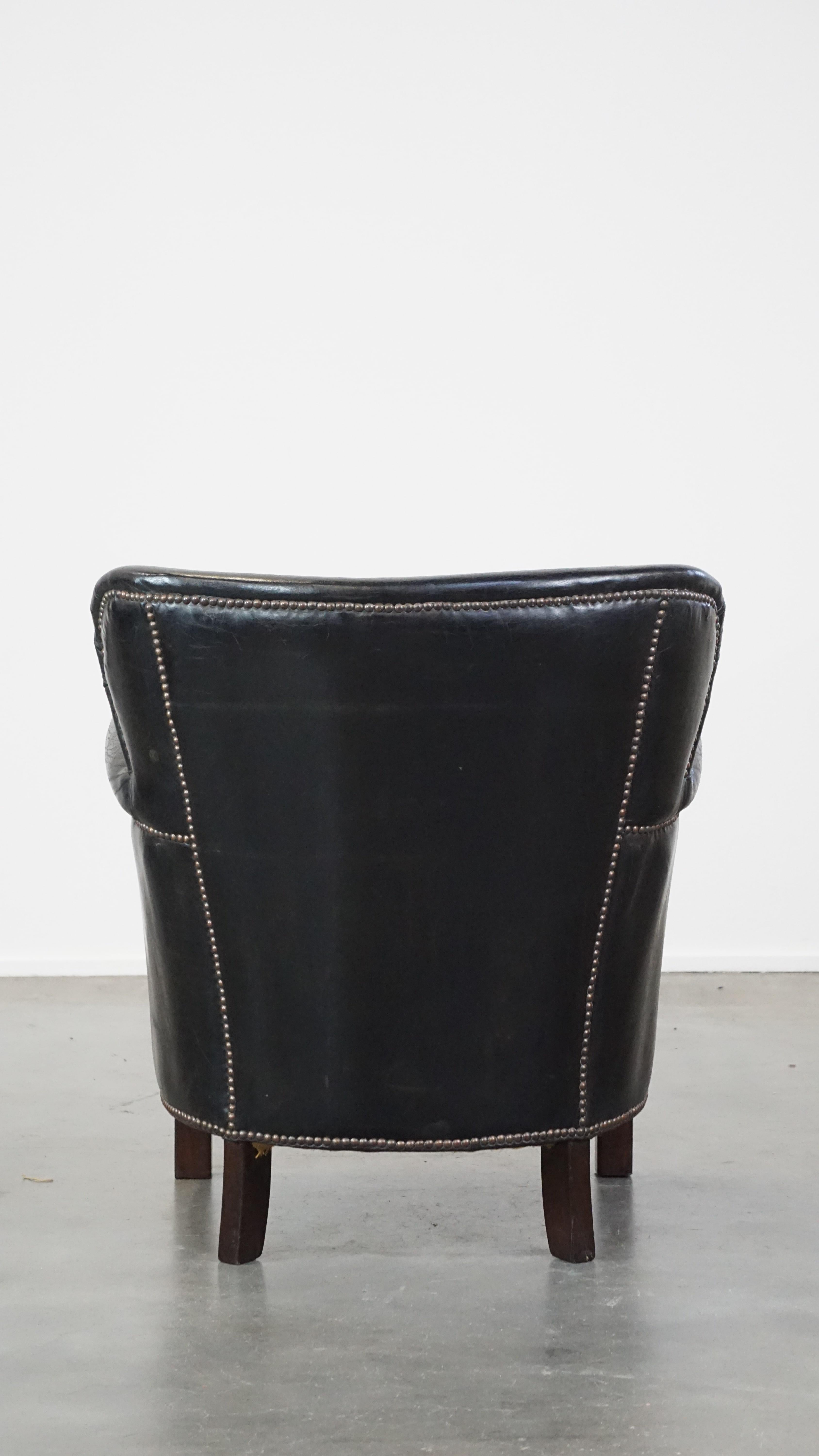 20th Century Subtle black cow leather armchair with reversible Kelim seat cushion For Sale