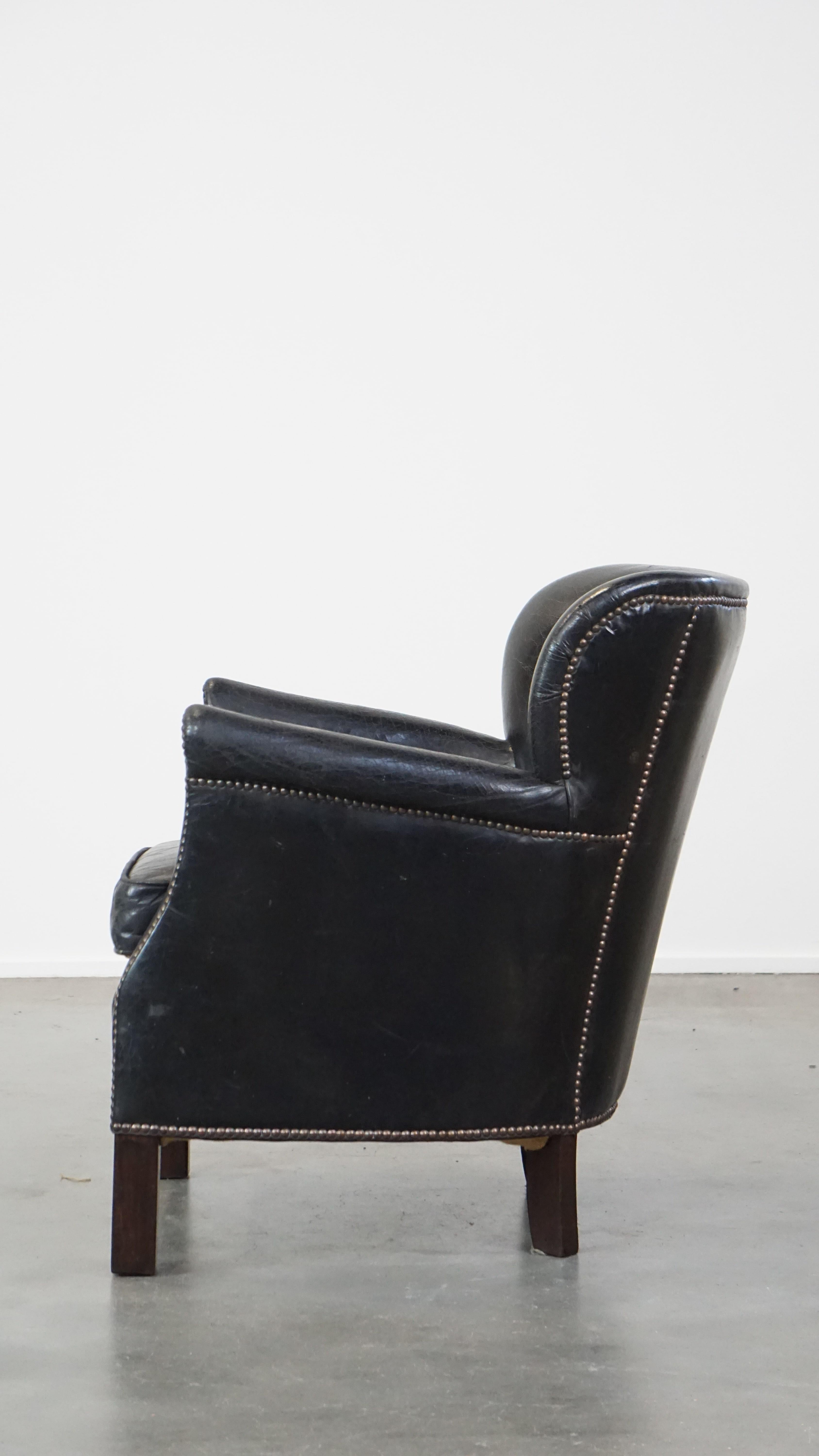 Cowhide Subtle black cow leather armchair with reversible Kelim seat cushion For Sale
