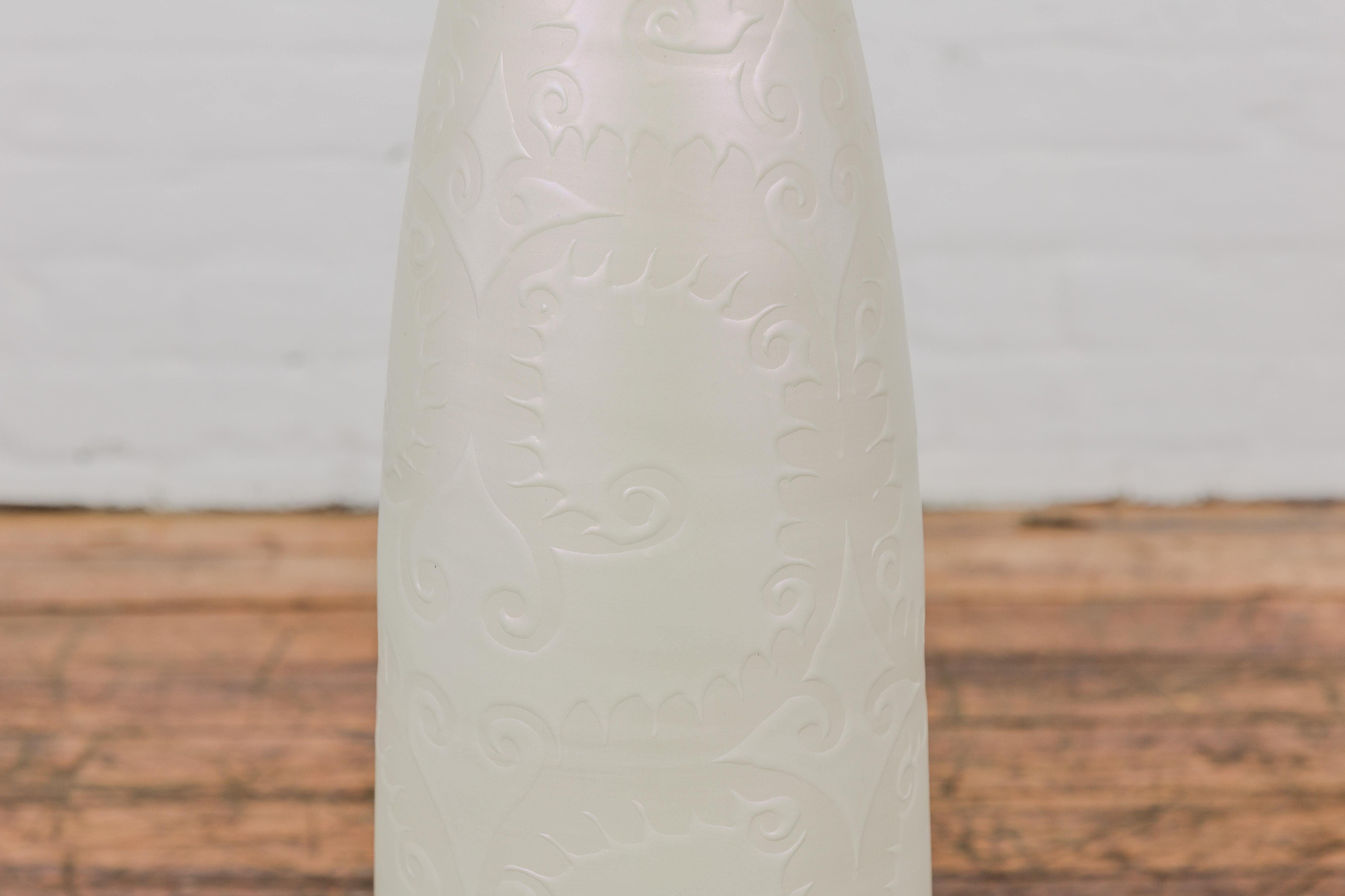 Ceramic Subtle Ivory Color Tall Vase with Raised Scrolling Motifs and Narrow Mouth For Sale