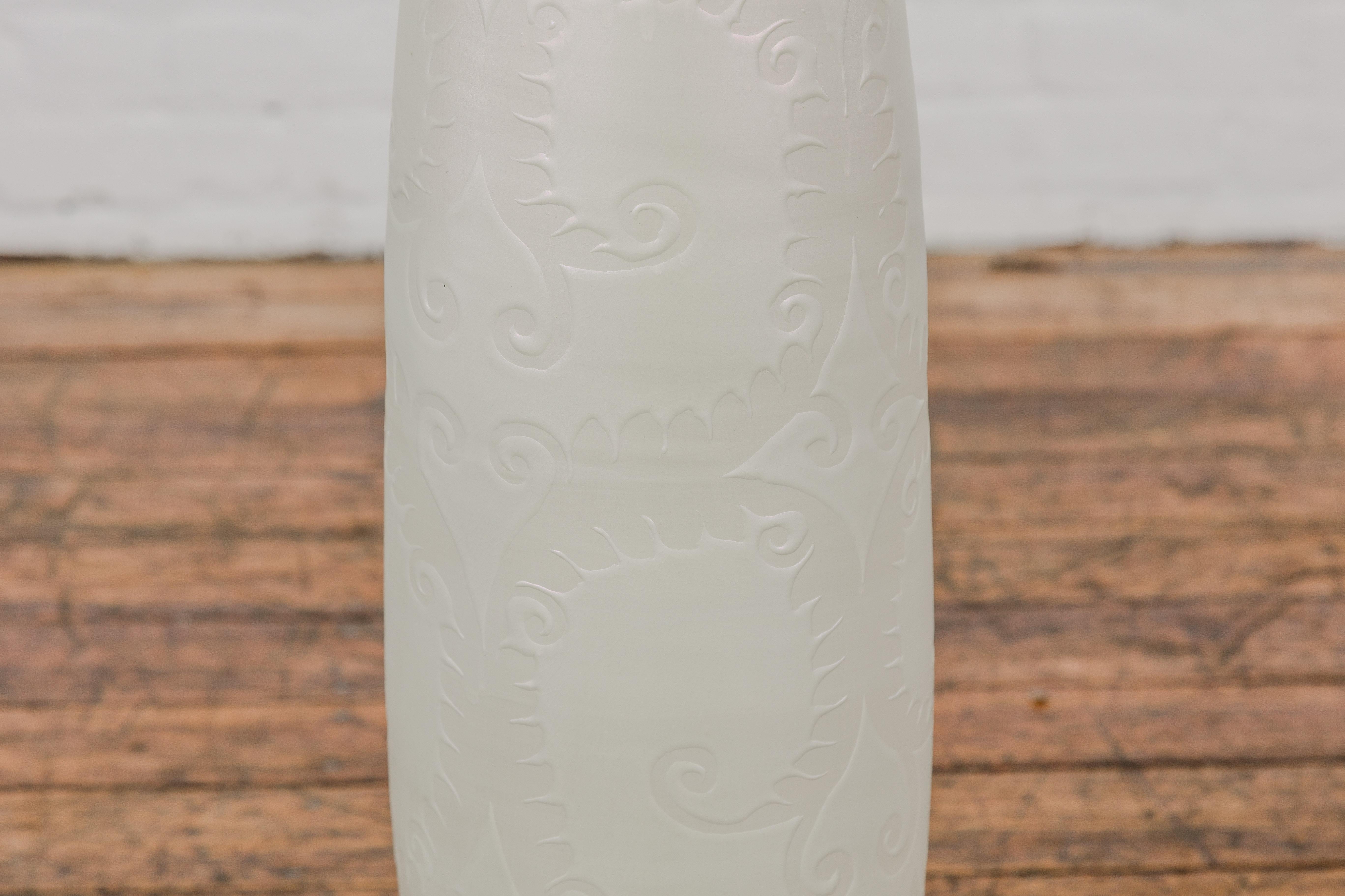 Subtle Ivory Color Tall Vase with Raised Scrolling Motifs and Narrow Mouth For Sale 1