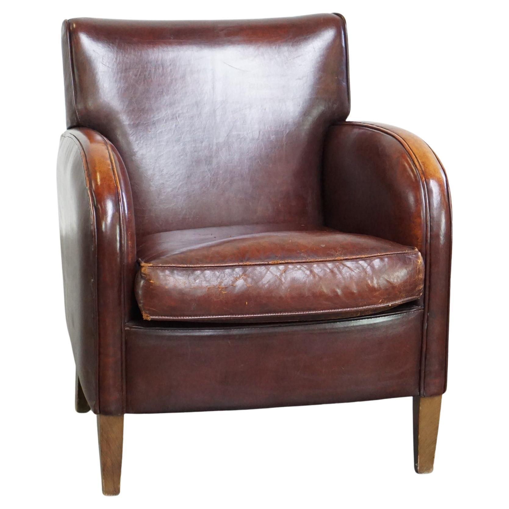 Subtle sheep leather armchair with a beautiful finish and a good patina