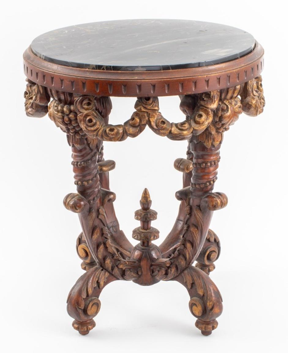 Sue et Mare manner Art Deco gilt wood side or occasional table with a Portoro marble top, the four legs carved with acanthus leaf details, the gilt wood skirt carved in the form of rose garlands. Measures: 24.5