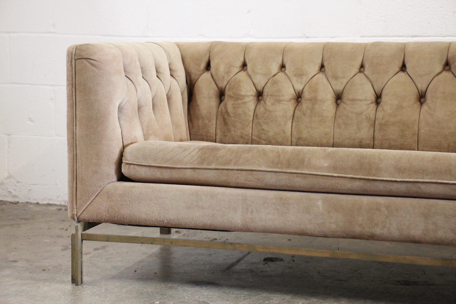 Nicely patinated original suede with solid bronze base sofa by Stow Davis. 
 