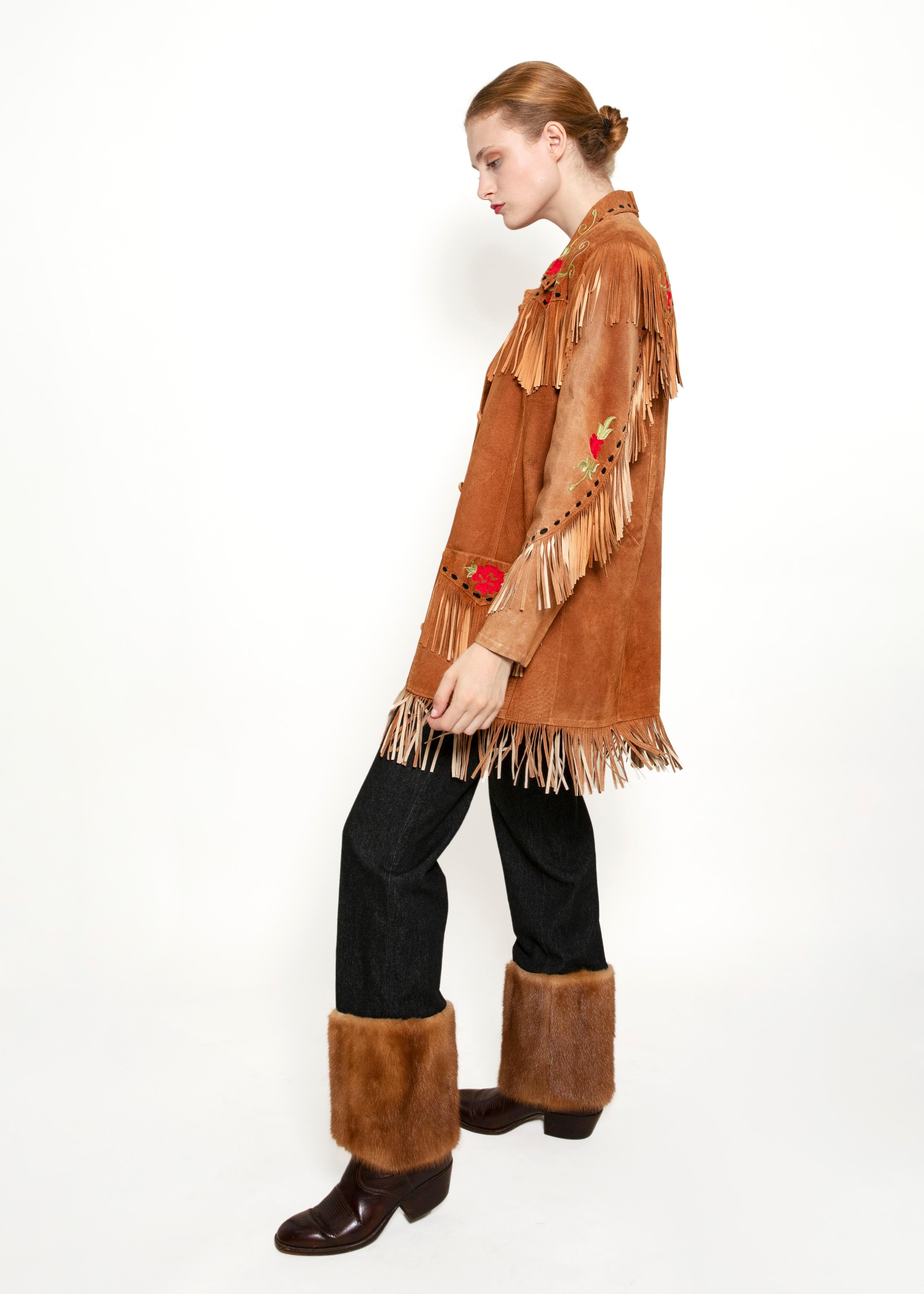 Embrace the wild west with our Suede Fringe & Embroidered Jacket! With its vintage embroidered floral pattern and western fringe, this jacket will add a daring edge to your outfit. Take a risk, make a statement, and stand out from the