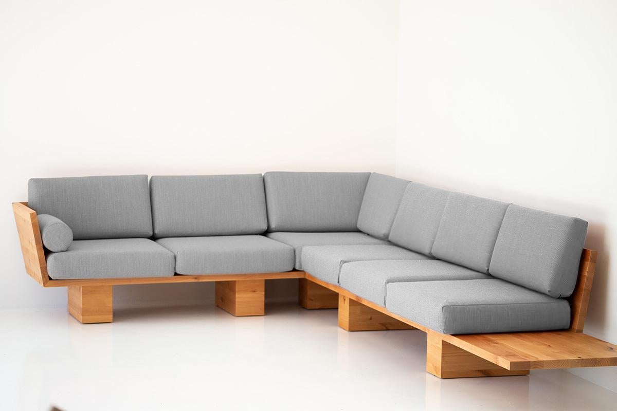 This Suelo modern wood sectional - 4622 is beautifully constructed from solid wood in Ohio, USA. The sofa's silhouette is simple, modern, and sleek with comfortable back and seat cushions. This is the perfect sofa for any space, indoor or outdoor.