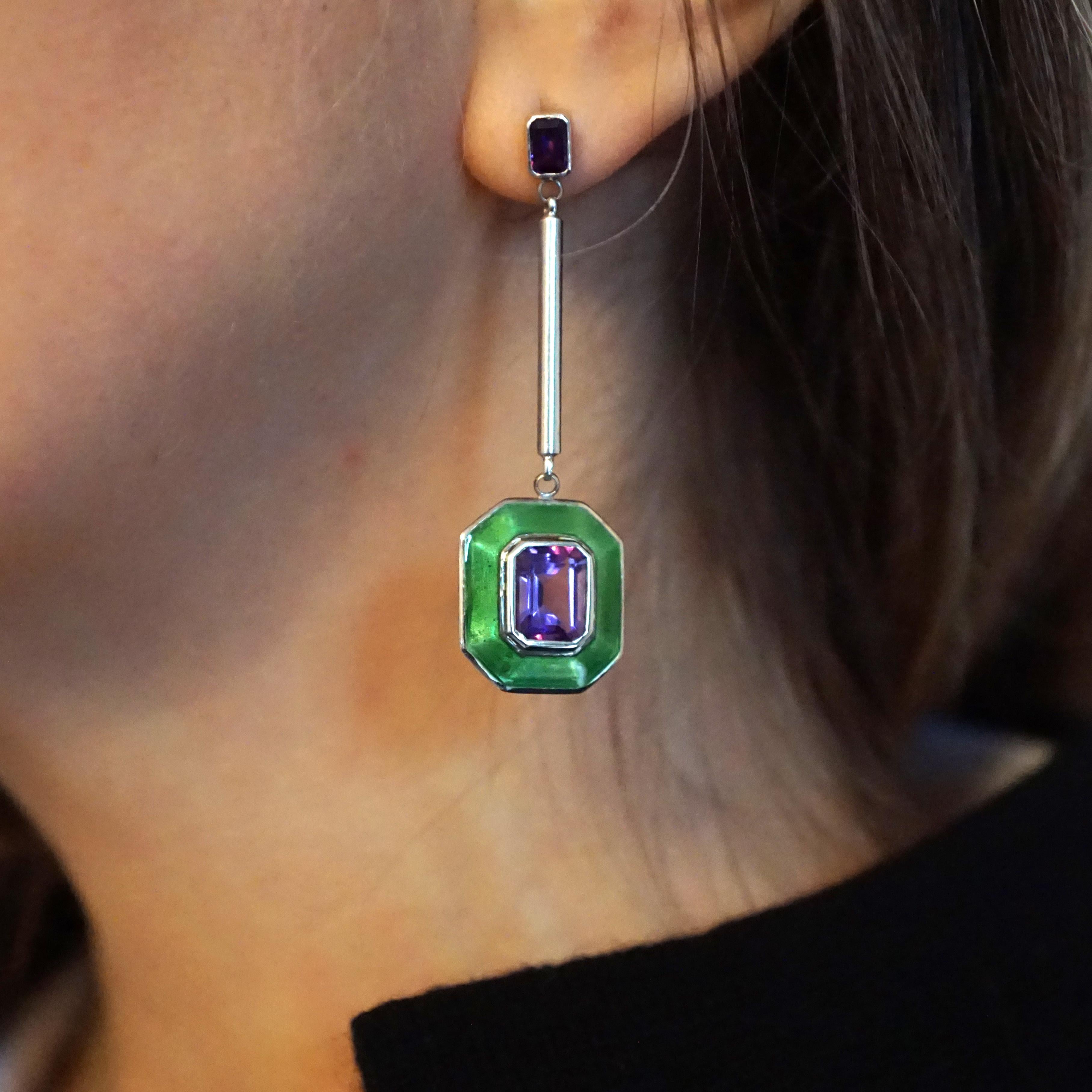 Rooted in clean, classic lines, this a bold yet elegant pair of earrings reflects the individuality of the wearer. Inspired by the Suffragettes we used white gold, amethyst and green dew vitreous enamel to celebrate the movement. These Art Deco