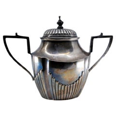 Sugar bowl in fluted silver, straight handles and wooden knob on the lid