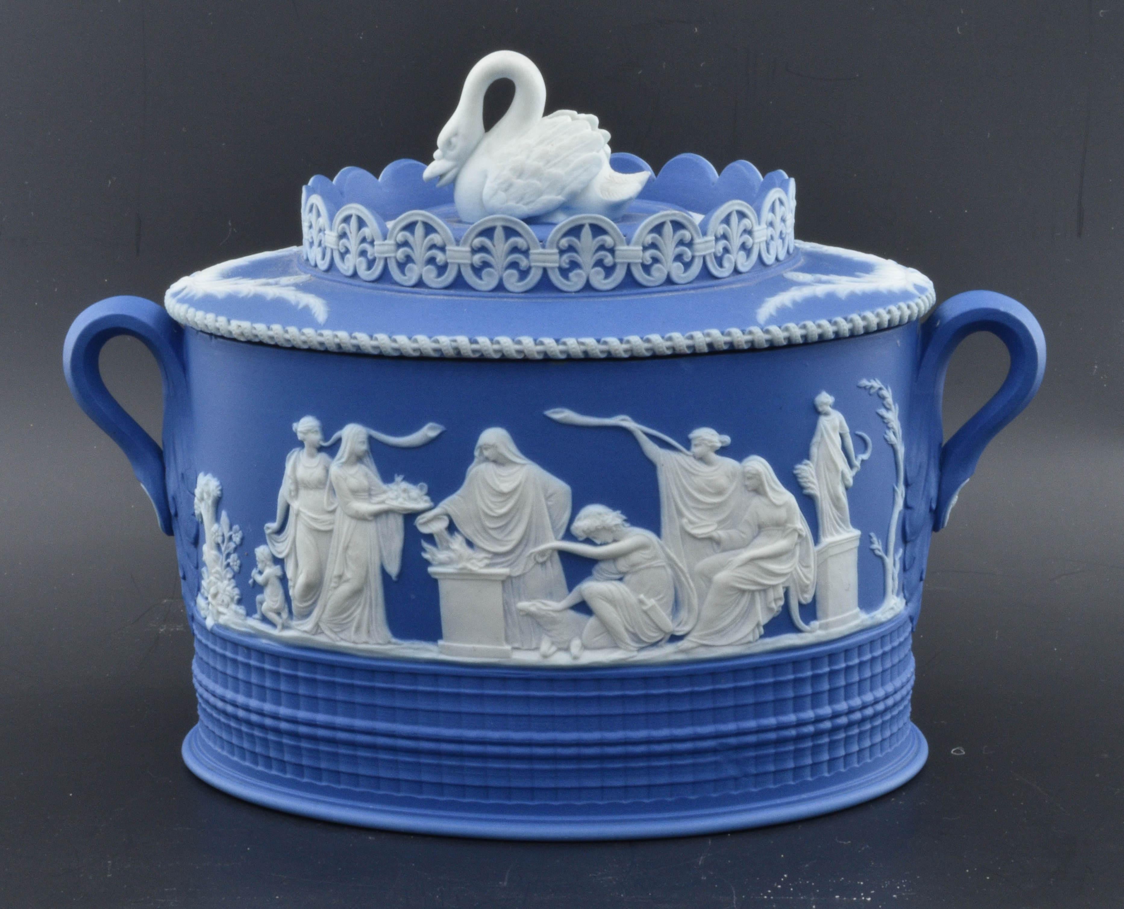 A fabulous oval sugar box, with elaborate applied relief, engine turning, and a swan finial. 

Impressed mark for Adams.

The Adams pottery company was founded by William Adams in the late 18th century. Adams was apprenticed to Josiah Wedgwood,