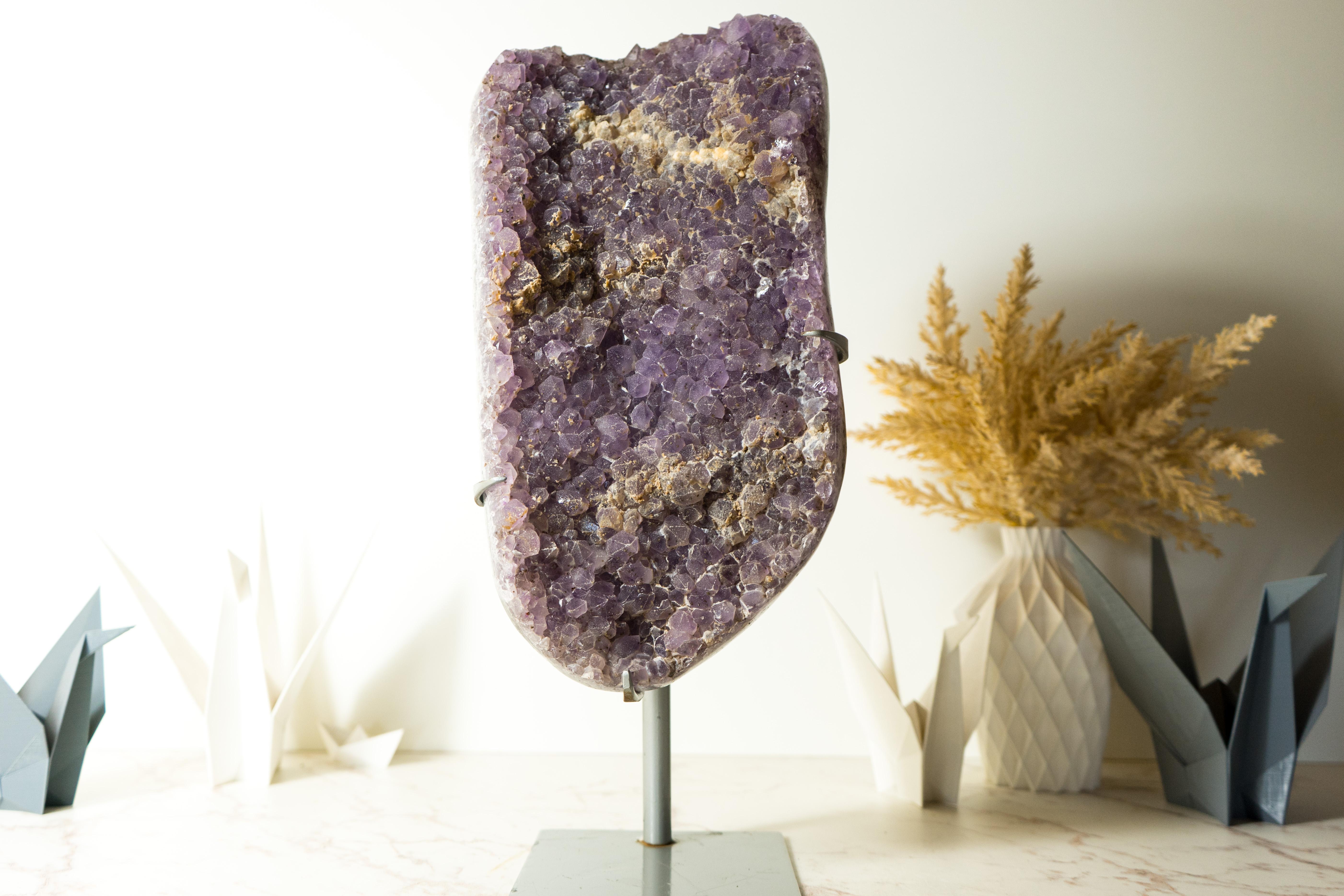 At first sight, this Amethyst may look like a normal Amethyst, but when you add some light to it, the WOW effect strikes, and its glittery shine as a galaxy! An Amethyst Galaxy Druzy cluster that is an exceptionally rare find, with a gorgeous,