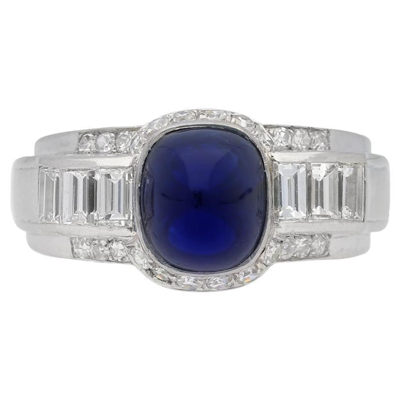 Sugar loaf cabochon sapphire and diamond ring, circa 1950.