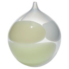 Sugar Snow, a round handblown clear, white & cream glass vessel by Gunnel Sahlin