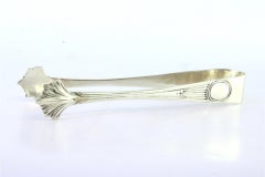 Sugar tongs in embossed silver with grooves along the handle
