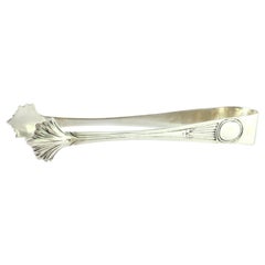 Sugar tongs in embossed silver with grooves along the handle