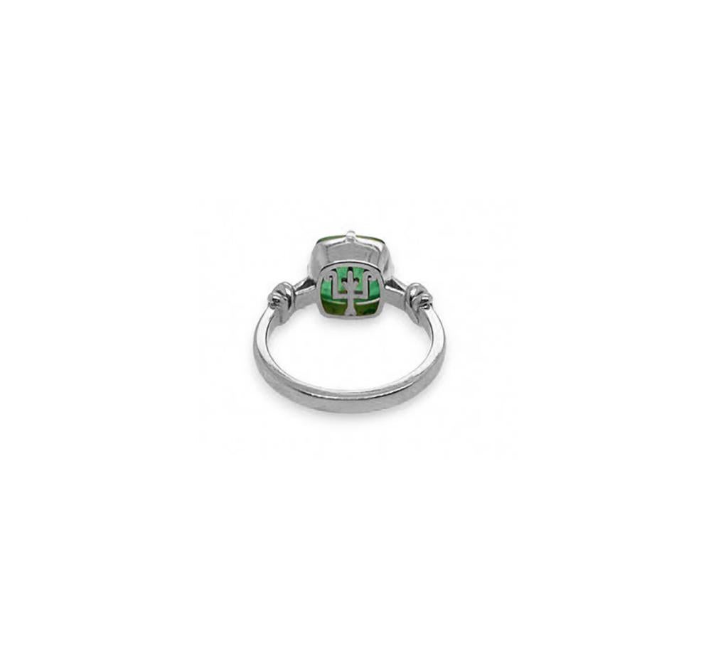 Glamorously bold and unabashedly seductive. This showstopper ring features a deliciously green sugarloaf emerald set with eagle style talons and embraced by powerful-gold, knotted ropes, converging to two knots on either side of the luscious