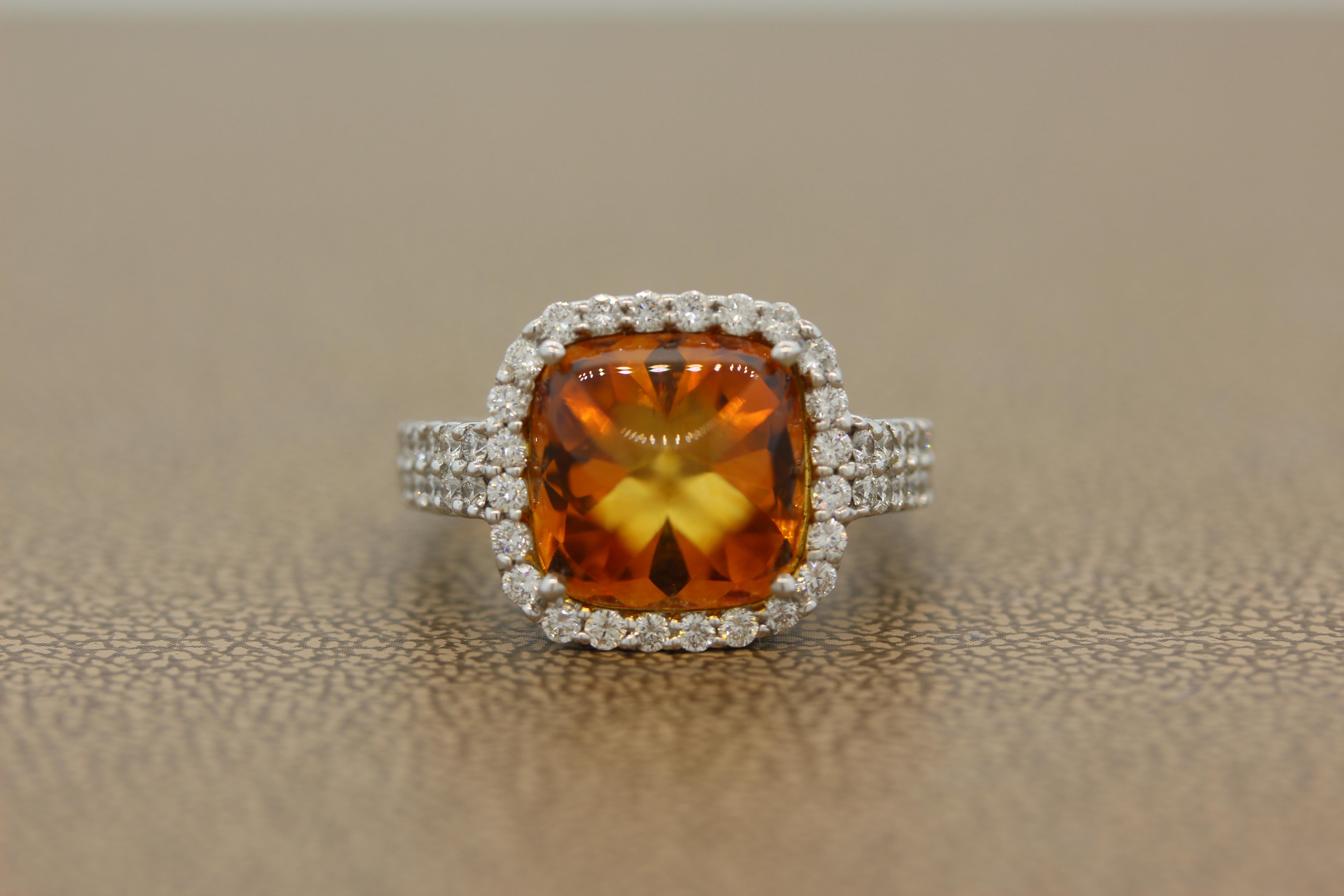 A delightful ring featuring a rich tone citrine weighting 6.93 carats. The sugarloaf citrine is haloed by 0.97 carats of round cut sparkling colorless diamonds set in 14K white gold.

Ring Size 7.25 (Sizable)

