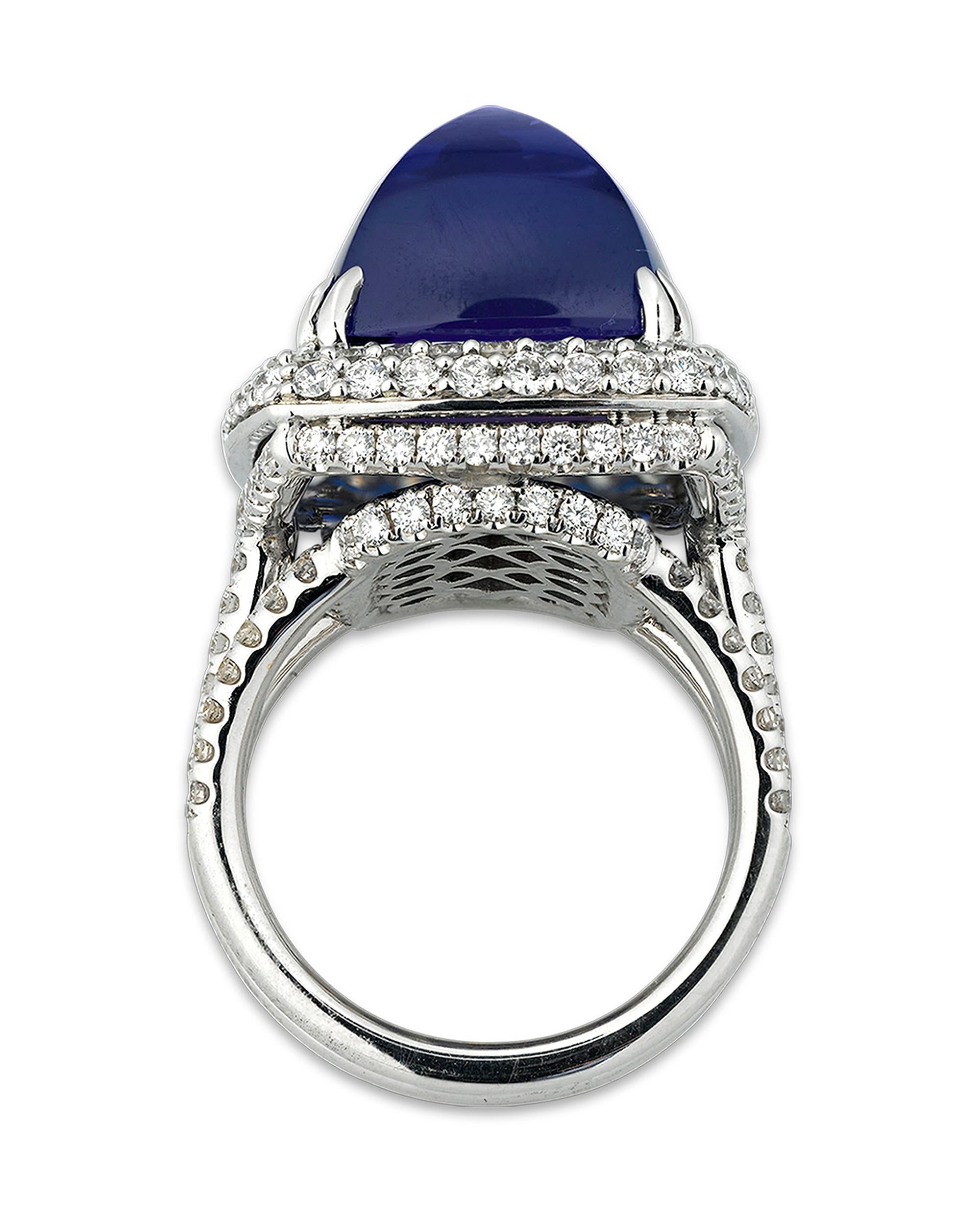 This vibrant and rare sugarloaf-cut tanzanite reflects the perfect violetish-blue hue for which the best of these gems are so coveted. Weighing a striking 22.10 carats, the rarity of this gem is compounded by its beautiful and unique cut. Rather