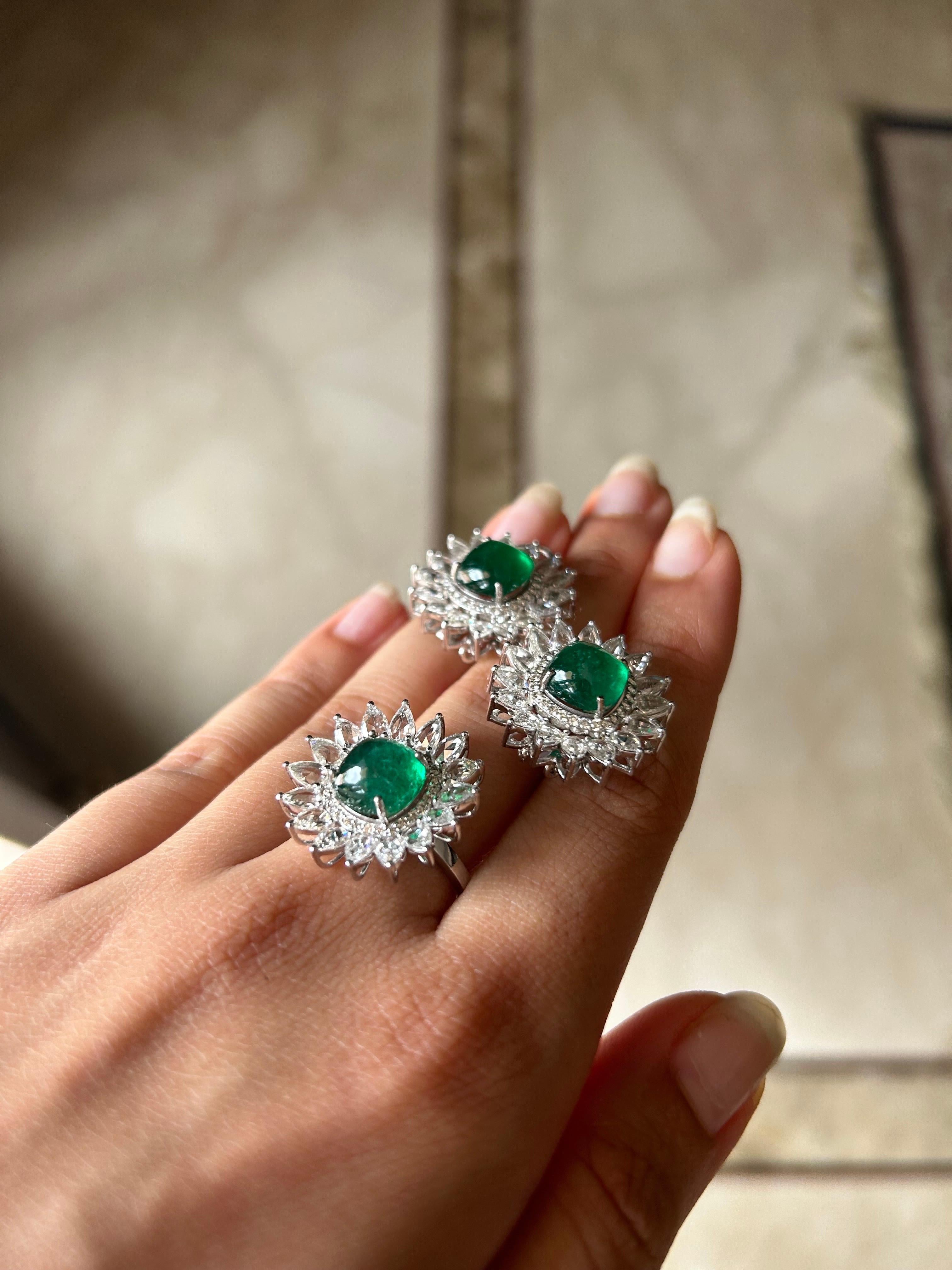 A unique pair of earrings and ring set, with  transparent, beautiful vivid green color natural sugarloaf Zambian Emeralds and White Diamonds. 
The earrings have a total of 3.71 carats Diamond and 6.97 carat Emeralds. The ring has a total of 1.9