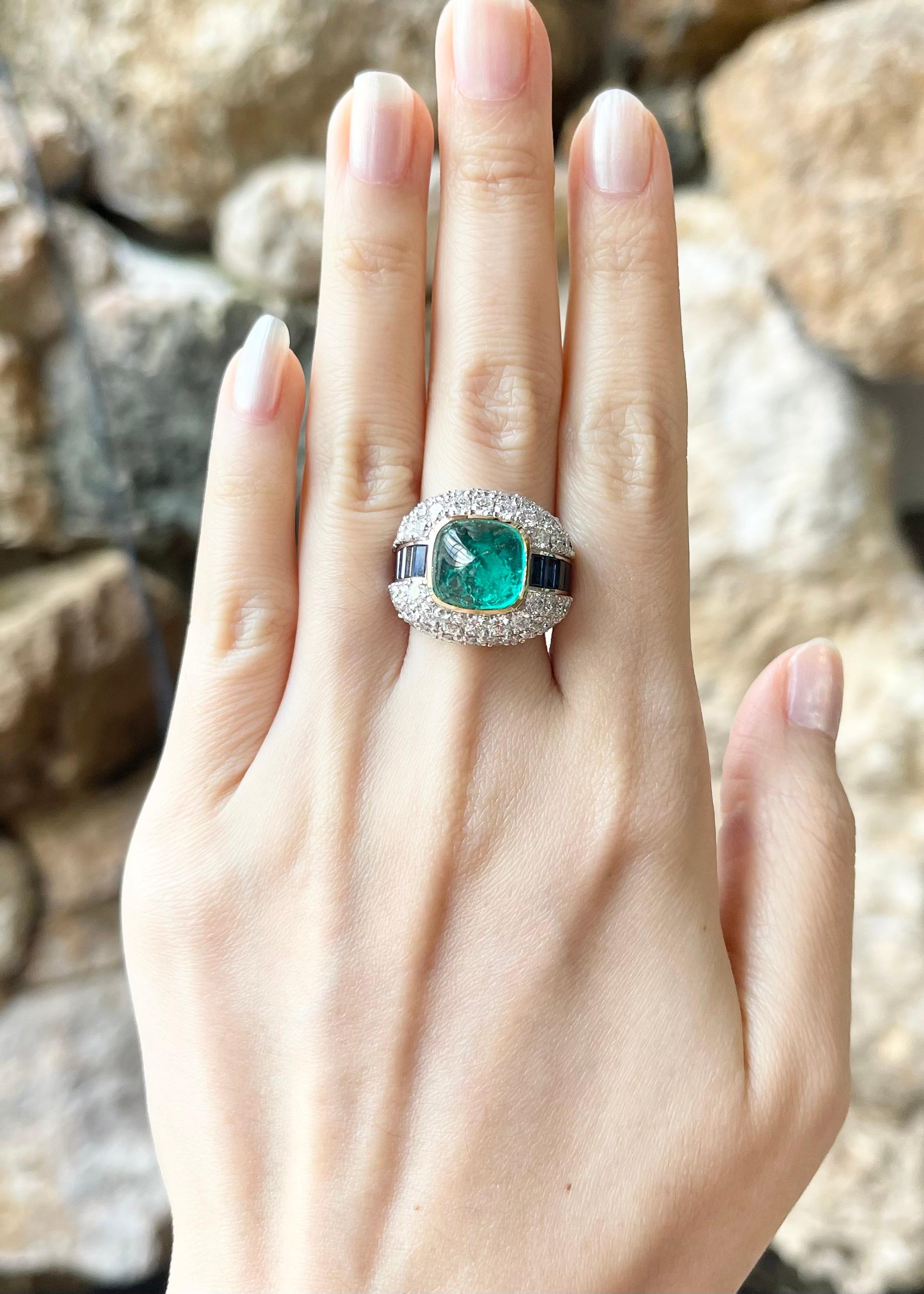 Sugarloaf Emerald 5.52 carats, Blue Sapphire 1.56 carats and Diamond 3.90 carats Ring set in 18K White Gold Settings

Width:  2.3 cm 
Length: 2.0 cm
Ring Size: 53
Total Weight: 17.59 grams

