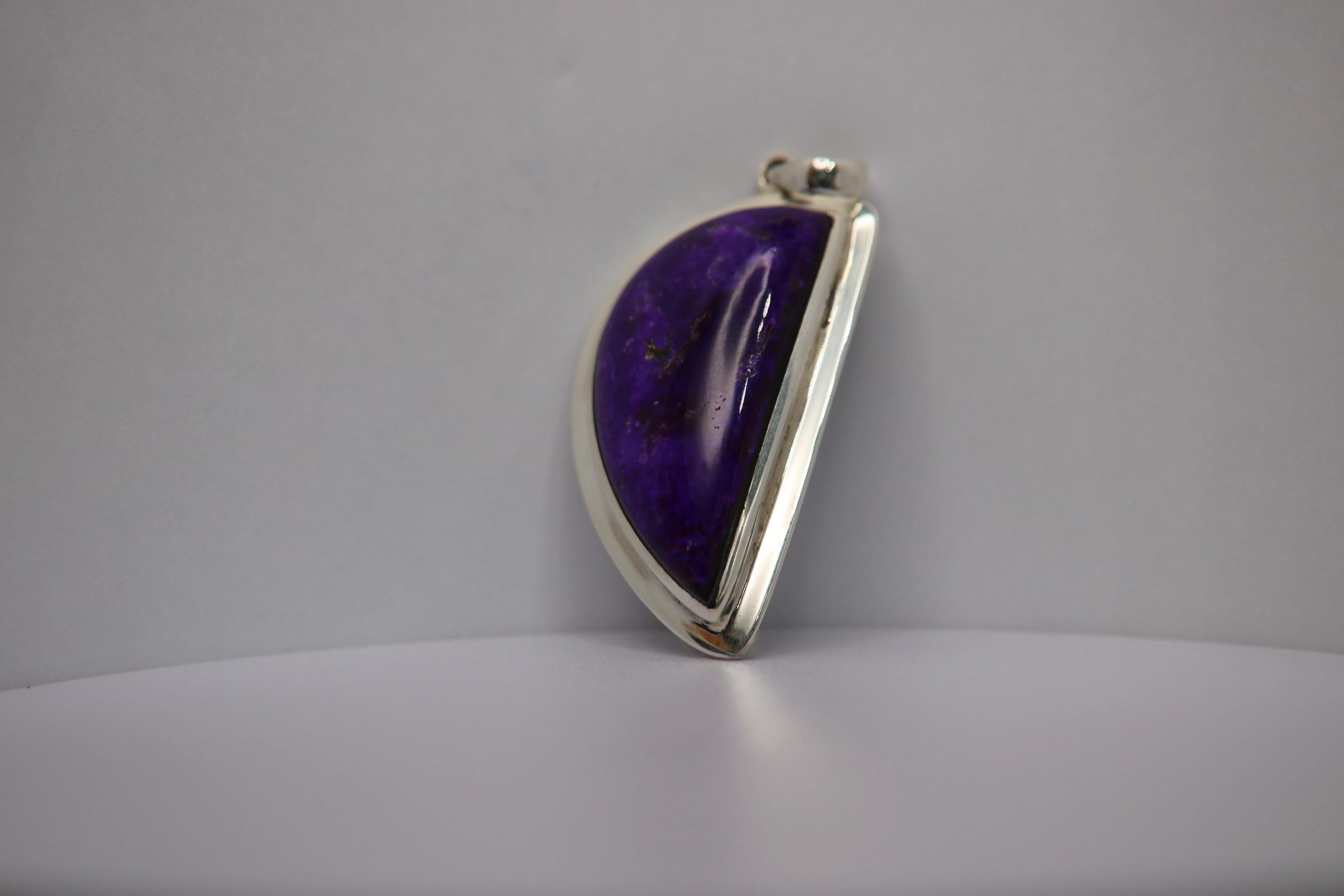 Handcrafted Sterling Silver Sugilite Pendant.

Sugilite, known for its rich purple color, is a rare gemstone that brings a touch of vibrant uniqueness to any collection. Originating primarily from Japan and South Africa, Sugilite ranges from deep