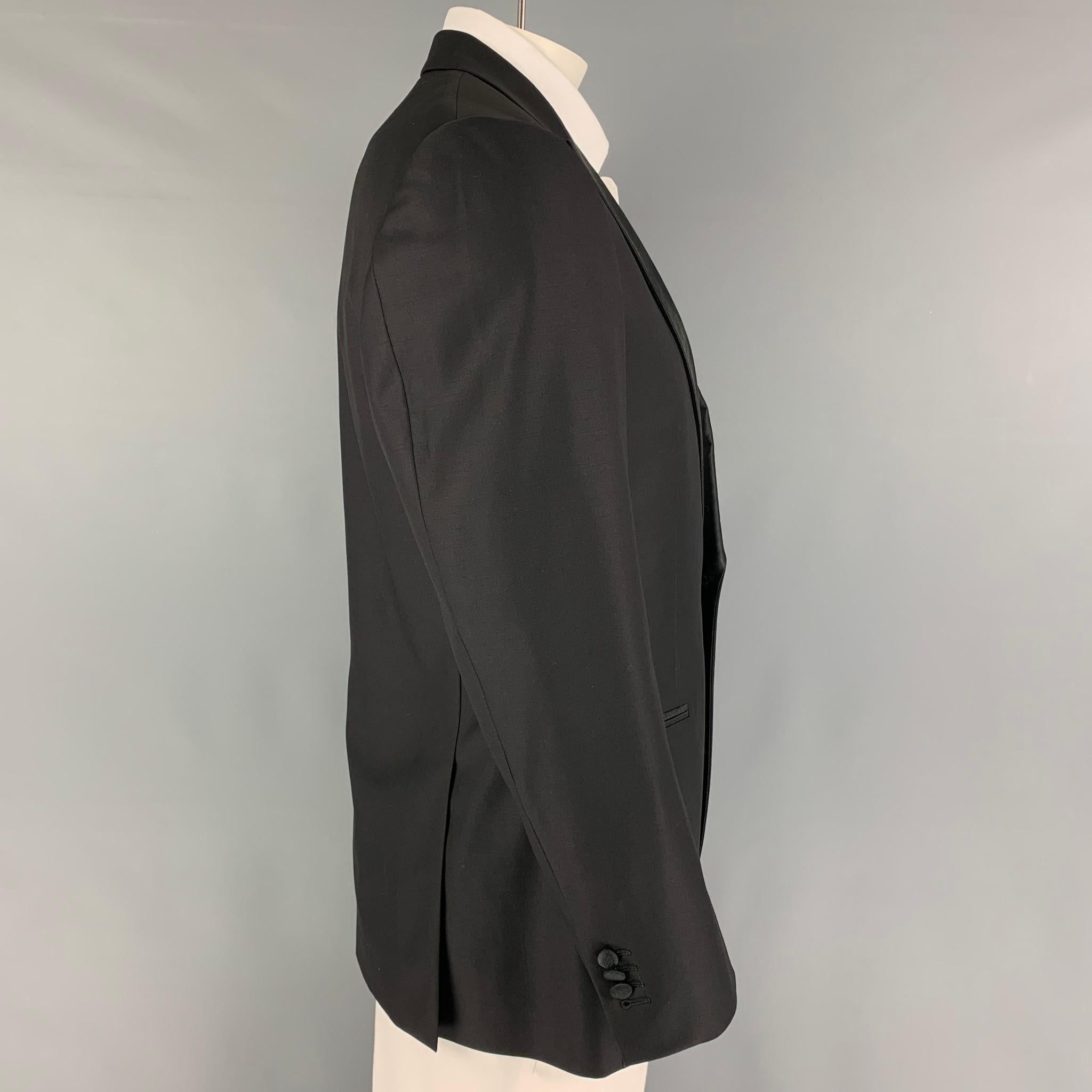 SUIT SUPPLY sport coat comes in a black wool  with a full liner featuring a peak lapel, slit pockets, double back vent, and a single button closure.

Excellent Pre-Owned Condition.
Marked: 44

Measurements:

Shoulder: 18.5 in.
Chest: 42 in.
Sleeve: