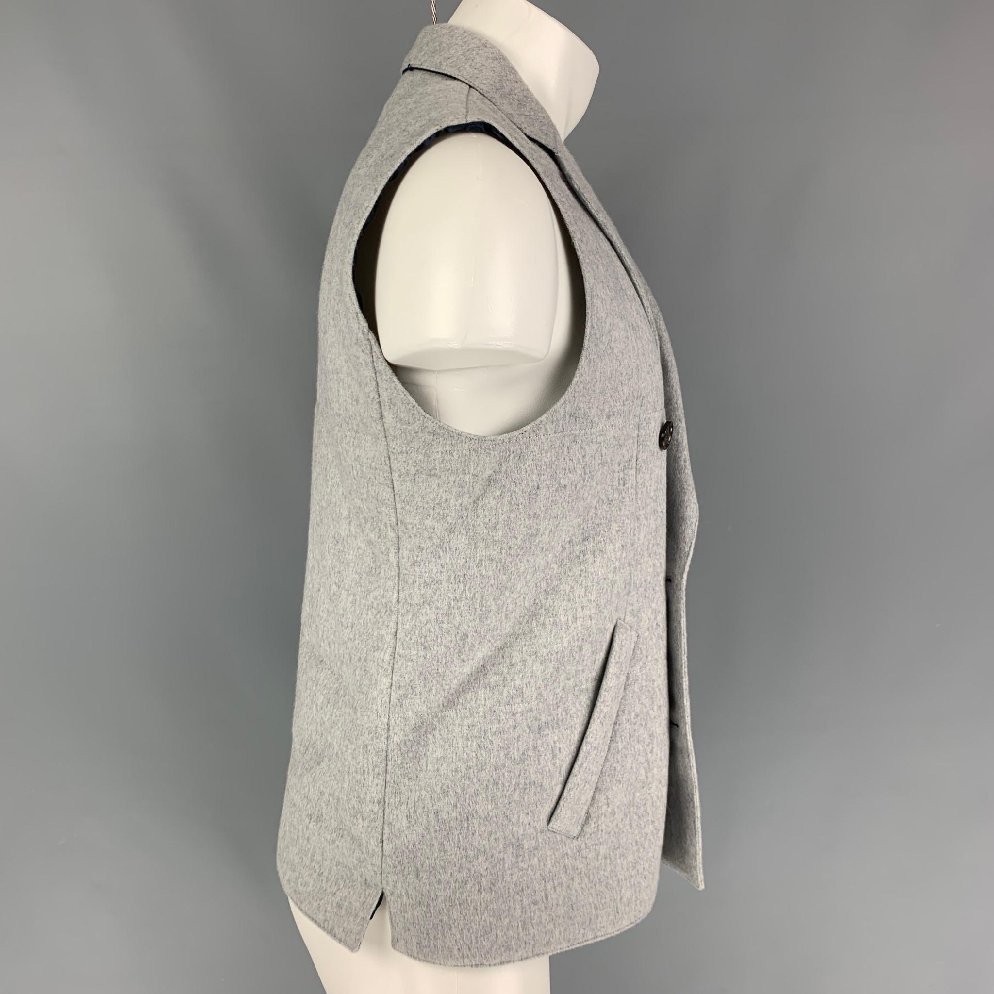 SUIT SUPPLY vest comes in a grey quilted cashmere featuring a notch lapel, slit pockets, and a double breasted closure. 

Very Good Pre-Owned Condition.
Marked: M

Measurements:

Shoulder: 16 in.
Chest: 38 in.
Length: 25 in. 