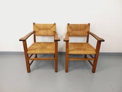 Suite de 2 fauteuils brutalistes vintage en bois de chêne et paille années 60