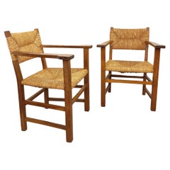 Suite de 2 fauteuils brutalistes vintage en bois de chêne et paille années 60