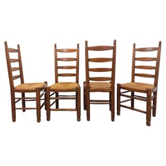 Suite de 4 chaises brutalistes Charles Dudouyt vintage en bois et paille