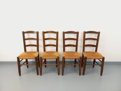 Suite de 4 chaises brutalistes vintage en bois et paille des années 60