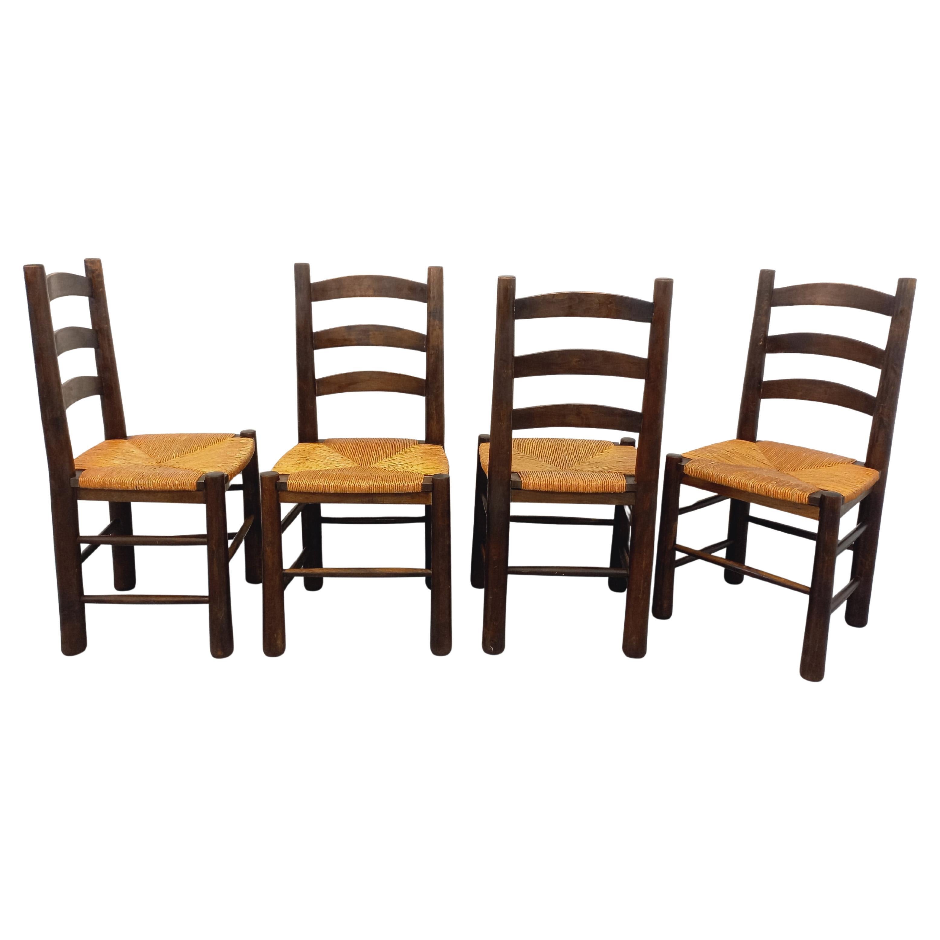 Suite de 4 chaises brutalistes vintage Georges Robert en bois et paille