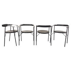 Suite de 4 chaises fauteuils vintage design italien en métal noir et skai noir