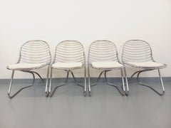 Suite de 4 chaises italiennes vintage Gastone Rinaldi en métal chromé et galette