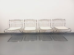 Suite de 4 chaises italiennes vintage Gastone Rinaldi en métal chromé et galette