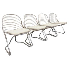 Suite de 4 chaises italiennes vintage Gastone Rinaldi en métal chromé et galette