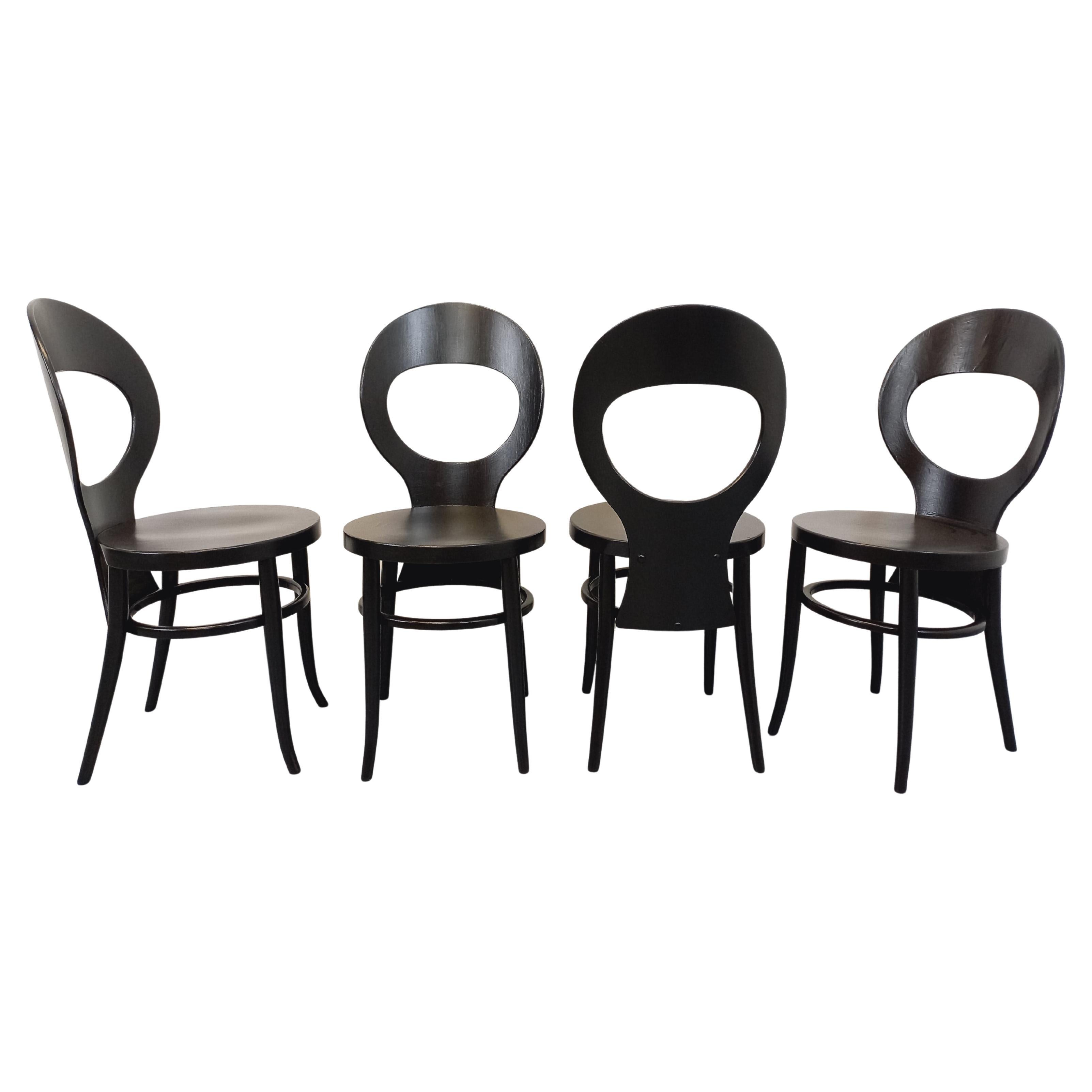 Suite de 4 chaises Mouette vintage de marque Baumann en bois noir des années 70