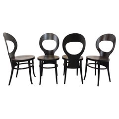 Suite de 4 chaises Mouette vintage de marque Baumann en bois noir des années 70