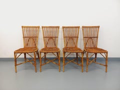 Suite de 4 chaises vintage Audoux Minet en rotin des années 50 60