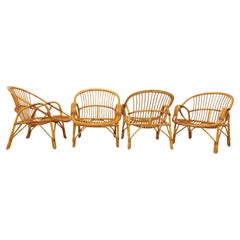Suite de 4 fauteuils vintage en rotin des années 60
