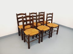 Suite de 6 chaises brutalistes vintage Georges Robert en bois et paille 1960