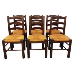 Suite de 6 chaises brutalistes vintage Georges Robert en bois et paille 1960