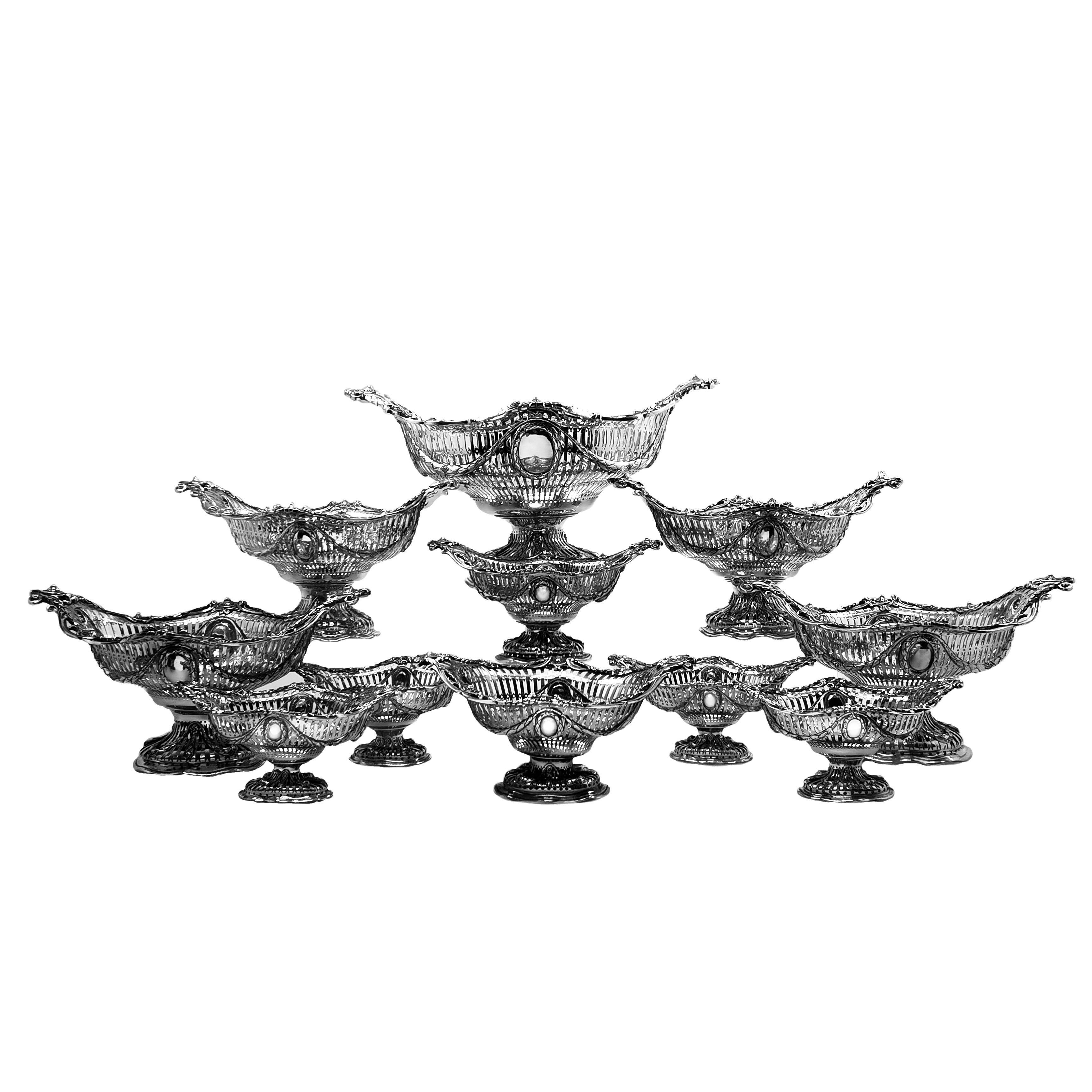 A magnificent Suite of 11 Sterling Silver Baskets made in the shape of classic 1770s Georgian Silver Adams Style Epergne Baskets. The Baskets make up an impressive centrepiece when used as suite can can be used in any number of configurations to