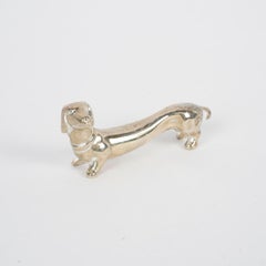 Suite of 12 Silver-Plated Dog-Shaped Knife Rests, 1980.