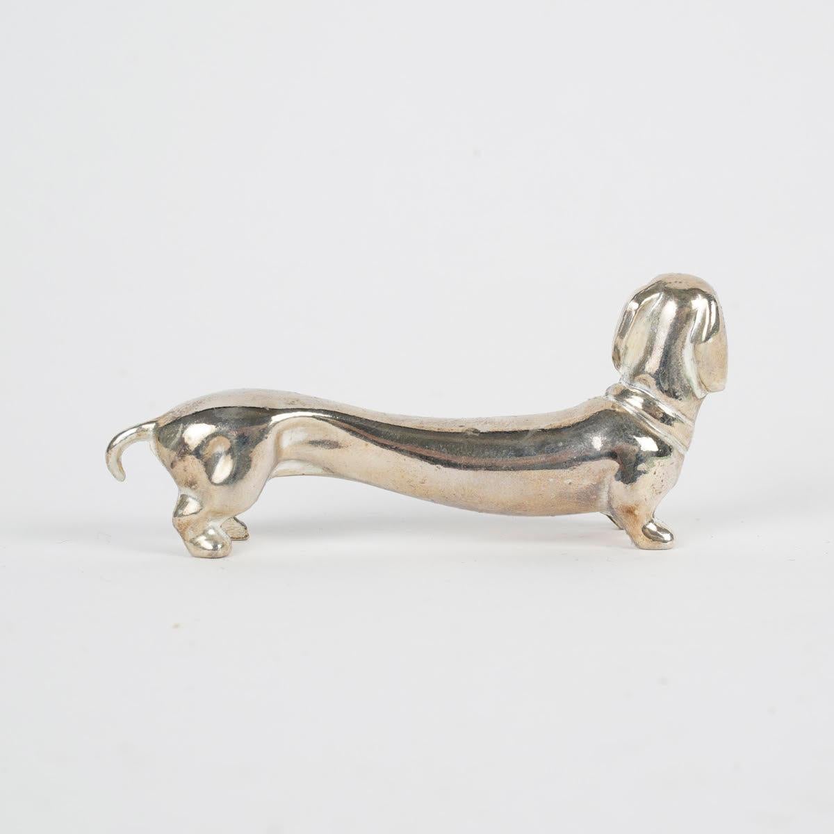 French Suite of 12 Silver-Plated Dog-Shaped Knife Rests, 1980.