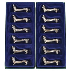 Suite of 12 Silver-Plated Dog-Shaped Knife Rests, 1980.